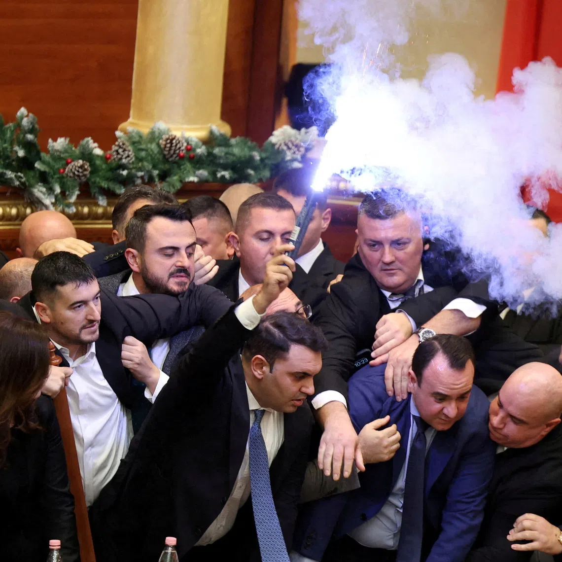 Members of parliament from the Democratic Party, Albania's biggest opposition party, protest against the government inside the parliament in Tirana, Albania, December 18, 2025. REUTERS/Stringer