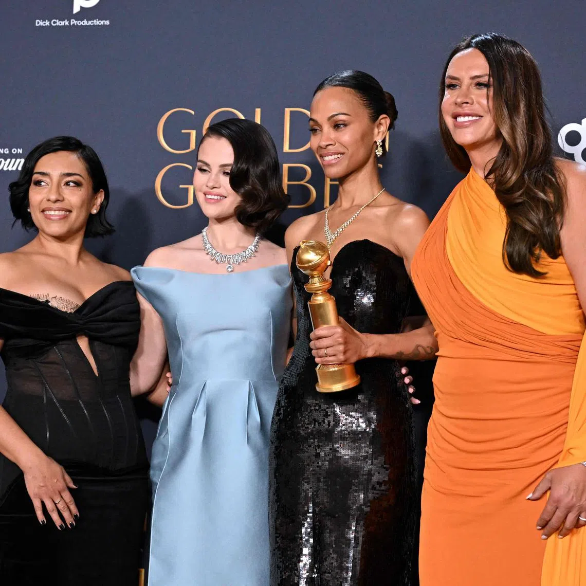(From left) Actresses Adriana Paz, Selena Gomez, Zoe Saldana and Karla Sofia Gascon pose with the Best Motion Picture - Musical or Comedy award for "Emilia Perez" on Jan 5.