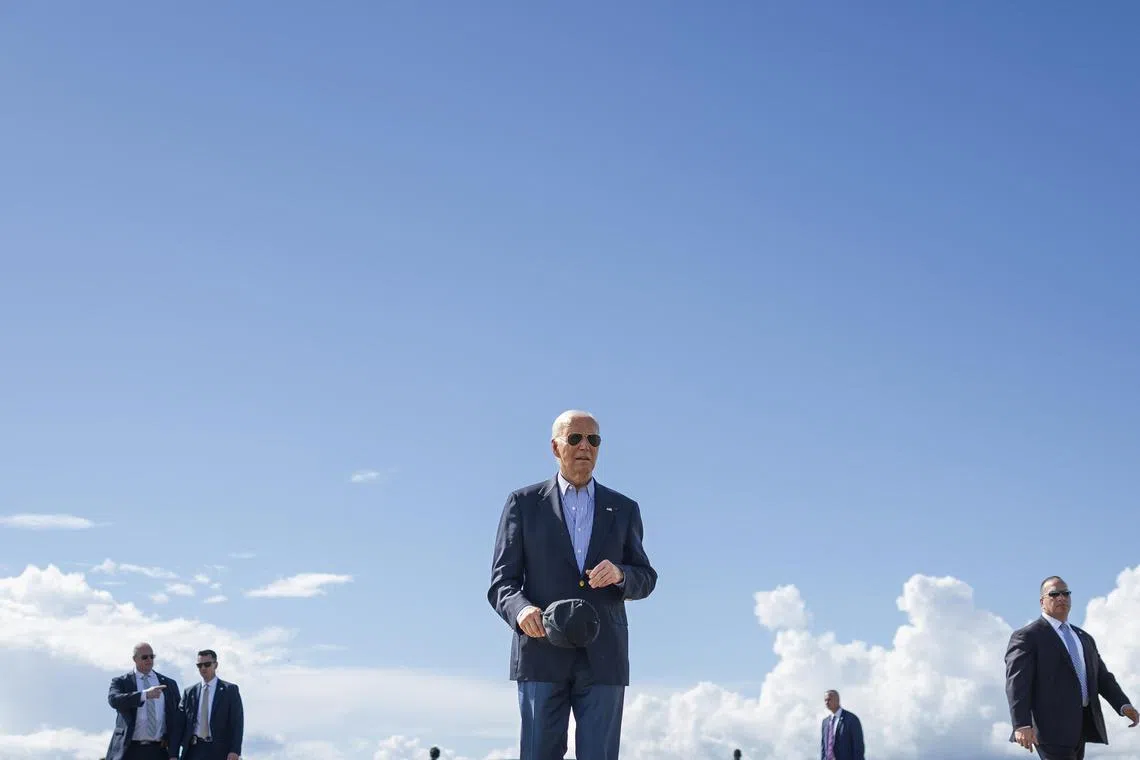 President Joe Biden walks to speak to reporters before boarding Air Force One in Madison, Wis., July 5, 2024. A close look at more than two dozen radio and podcast interviews given by Biden over the past two years reveals a distinct pattern: In appearance after appearance, the president has been served up nearly identical questions, prescreened or suggested ahead of time by campaign staff members. (Tom Brenner/The New York Times)
