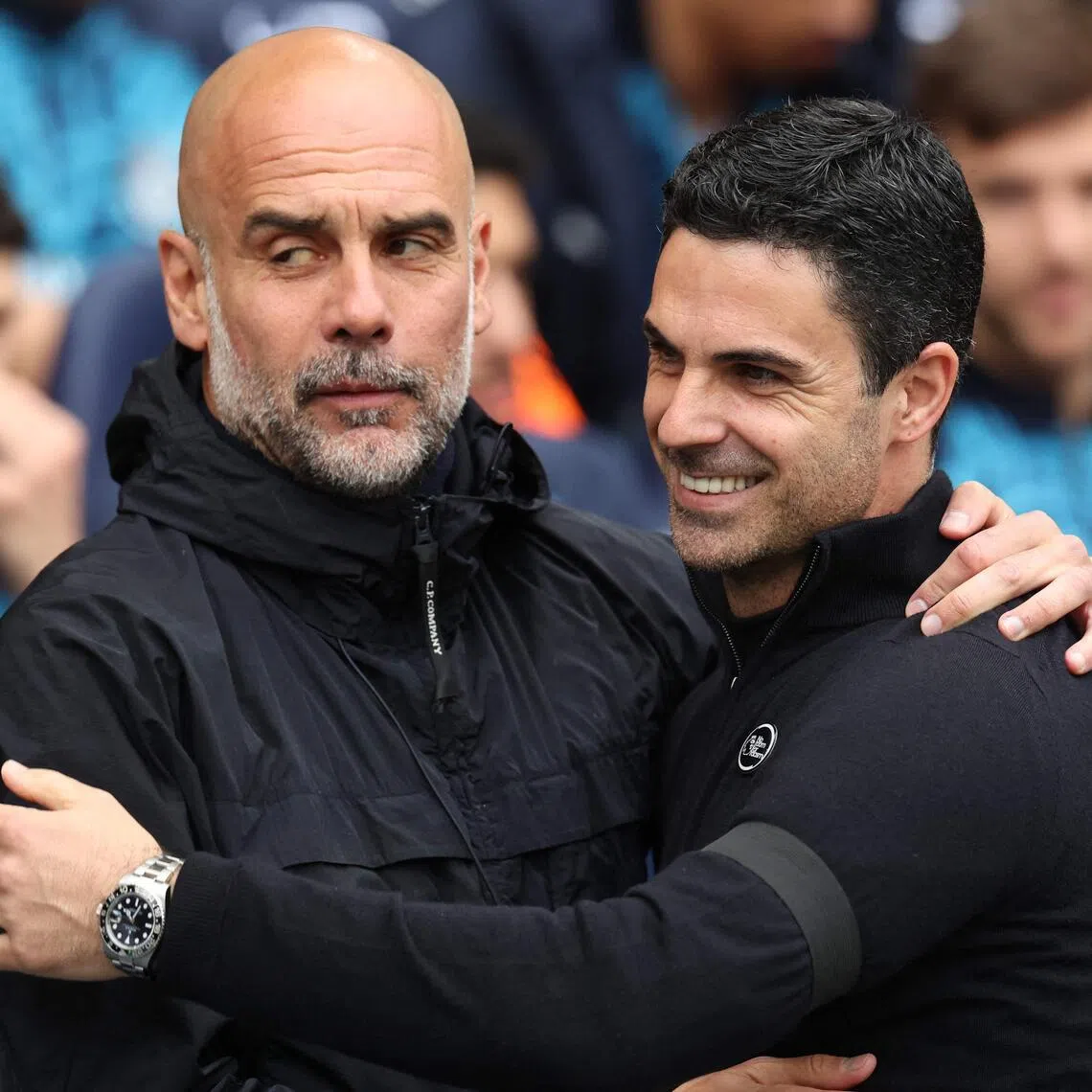 The top two teams in the Premier League this season, Arsenal and Manchester City, are coached by Spaniards Pep Guardiola (left) and Mikel Arteta.