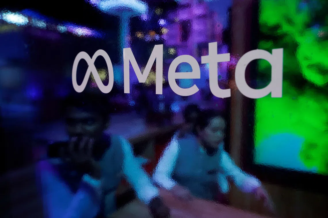  People are seen behind a logo of Meta Platforms, during a conference in Mumbai, India, September 20, 2023. REUTERS/Francis Mascarenhas/File Photo