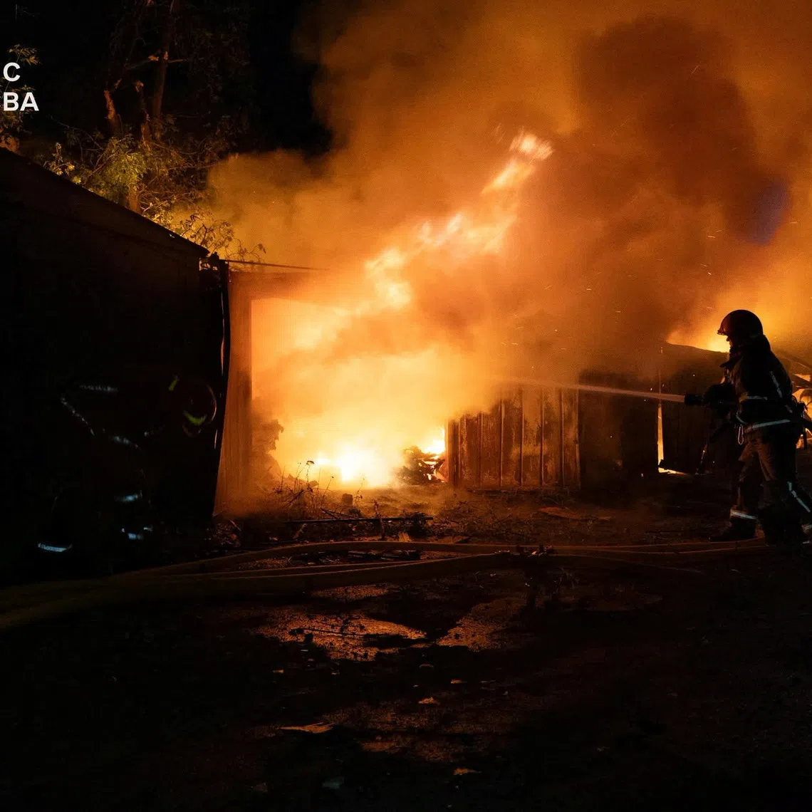 Firefighters work at a compound of car garages damaged during overnight Russian missile strikes, amid Russia's attack on Ukraine, in Kyiv, Ukraine August 8, 2026. Press service of the State Emergency Service of Ukraine/Handout via REUTERS