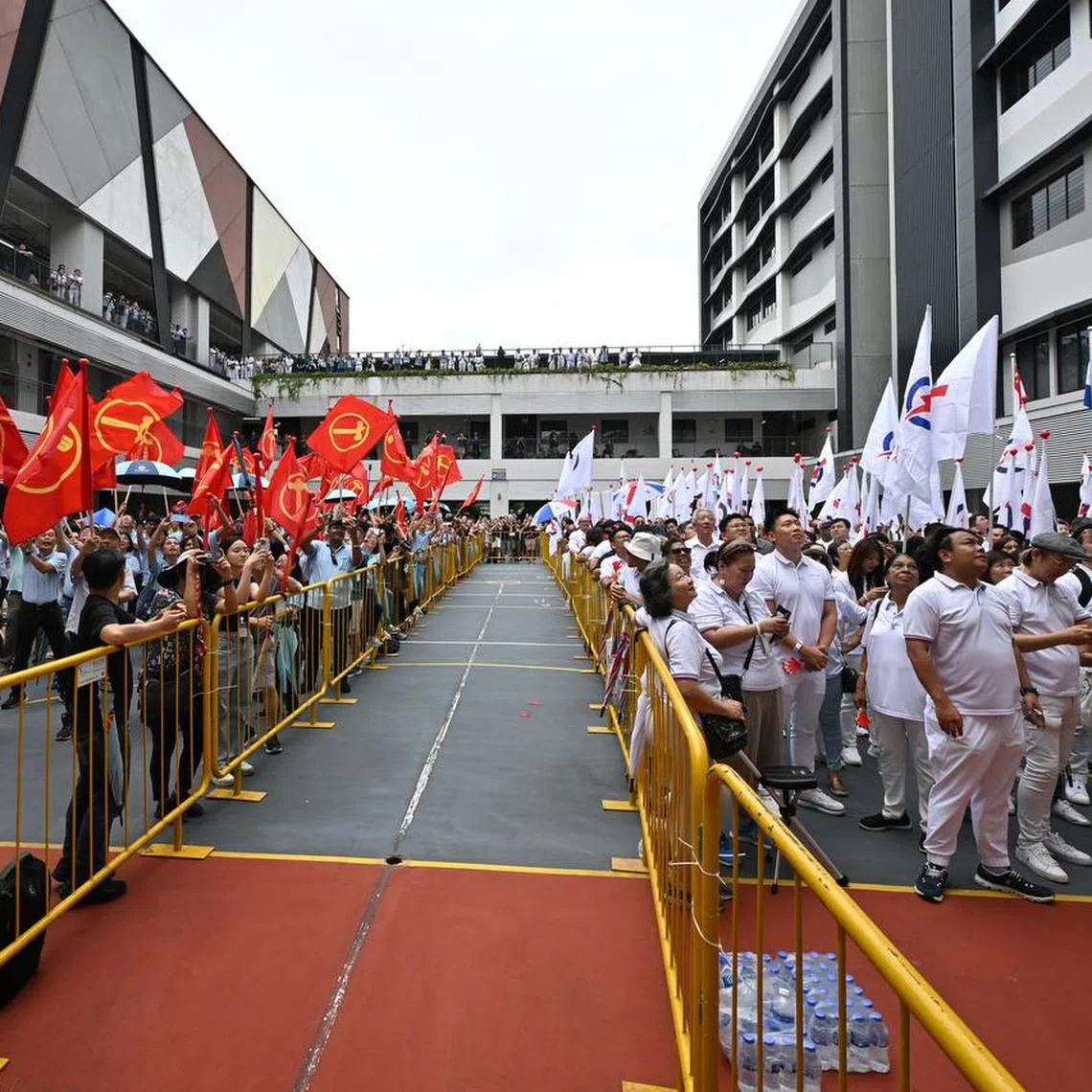 WP and PAP supporters at Yusof Ishak Secondary School during Nomination Day on April 23.