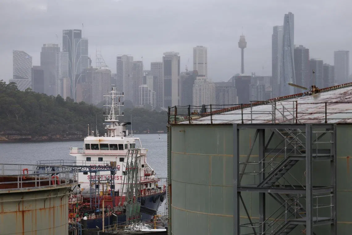 An oil tanker sits at Viva Energy Australia’s Gore Bay fuel terminal overlooking the city skyline in Sydney.