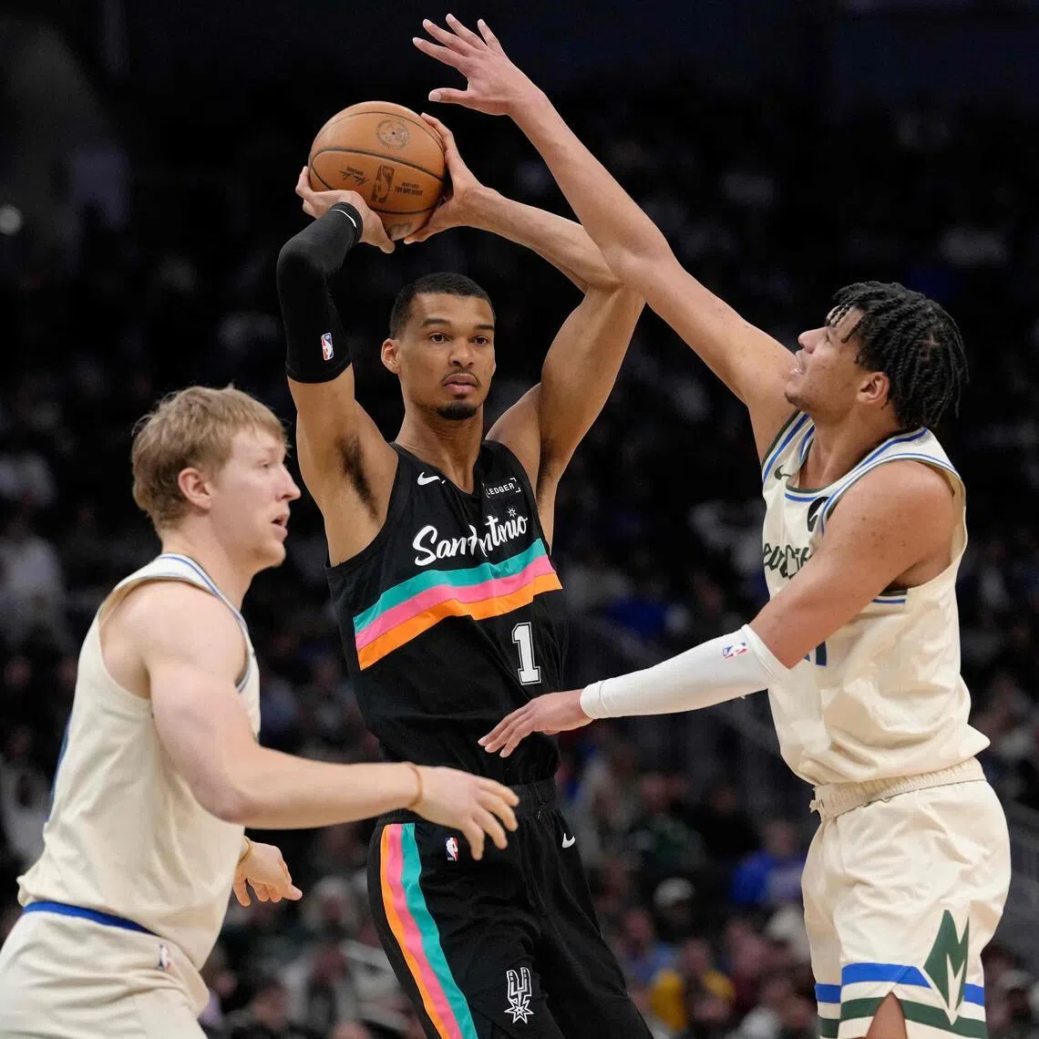 Victor Wembanyama of the San Antonio Spurs trying to get past the Milwaukee Bucks in the third quarter at Fiserv Forum.
