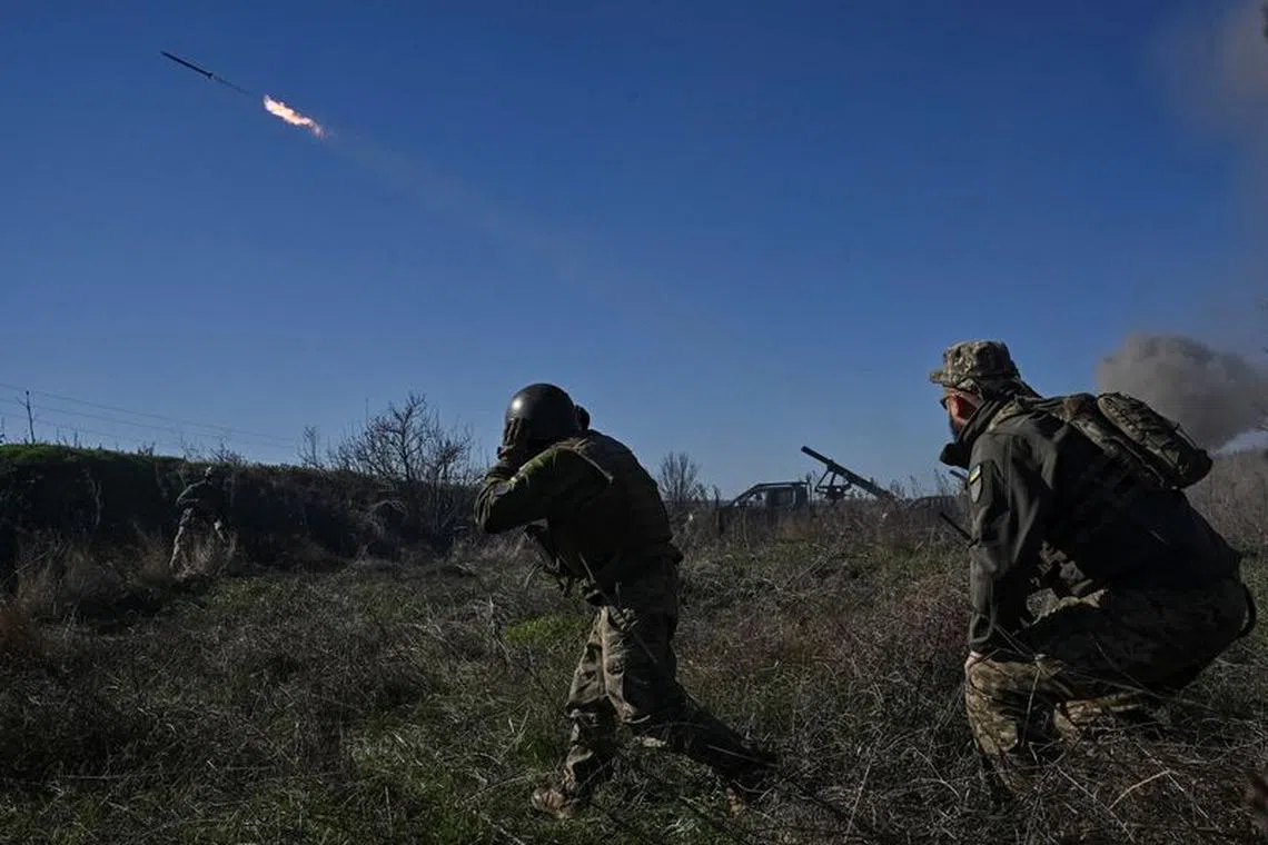 FILE PHOTO: Ukrainian servicemen fire a Partyzan small multiple rocket launch system toward Russian troops near a front line, amid Russia's attack on Ukraine, in Zaporizhzhia region, Ukraine November 7, 2023. REUTERS/Stringer/File photo