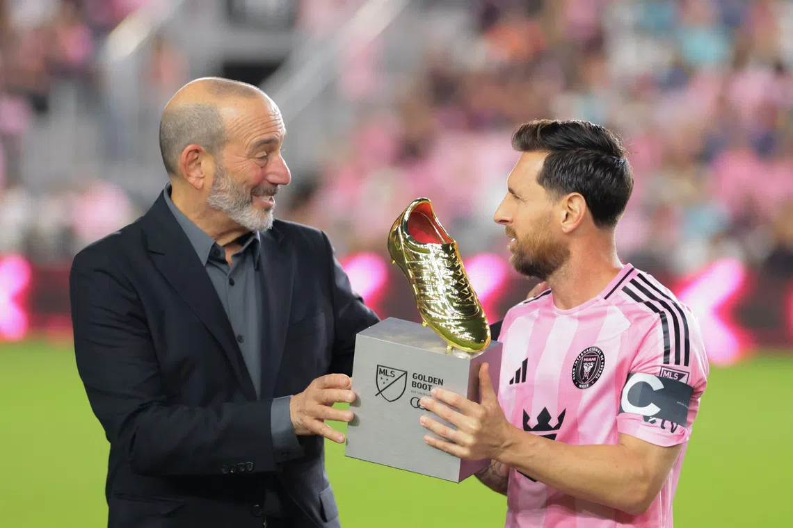 Oct 24, 2025; Fort Lauderdale, Florida, USA; MLS Commissioner Don Garber presents the MLS Golden Boot award for the most goals scored during the regular season to Inter Miami CF forward Lionel Messi (10) before the game against Nashville SC at Chase Stadium. Mandatory Credit: Sam Navarro-Imagn Images
