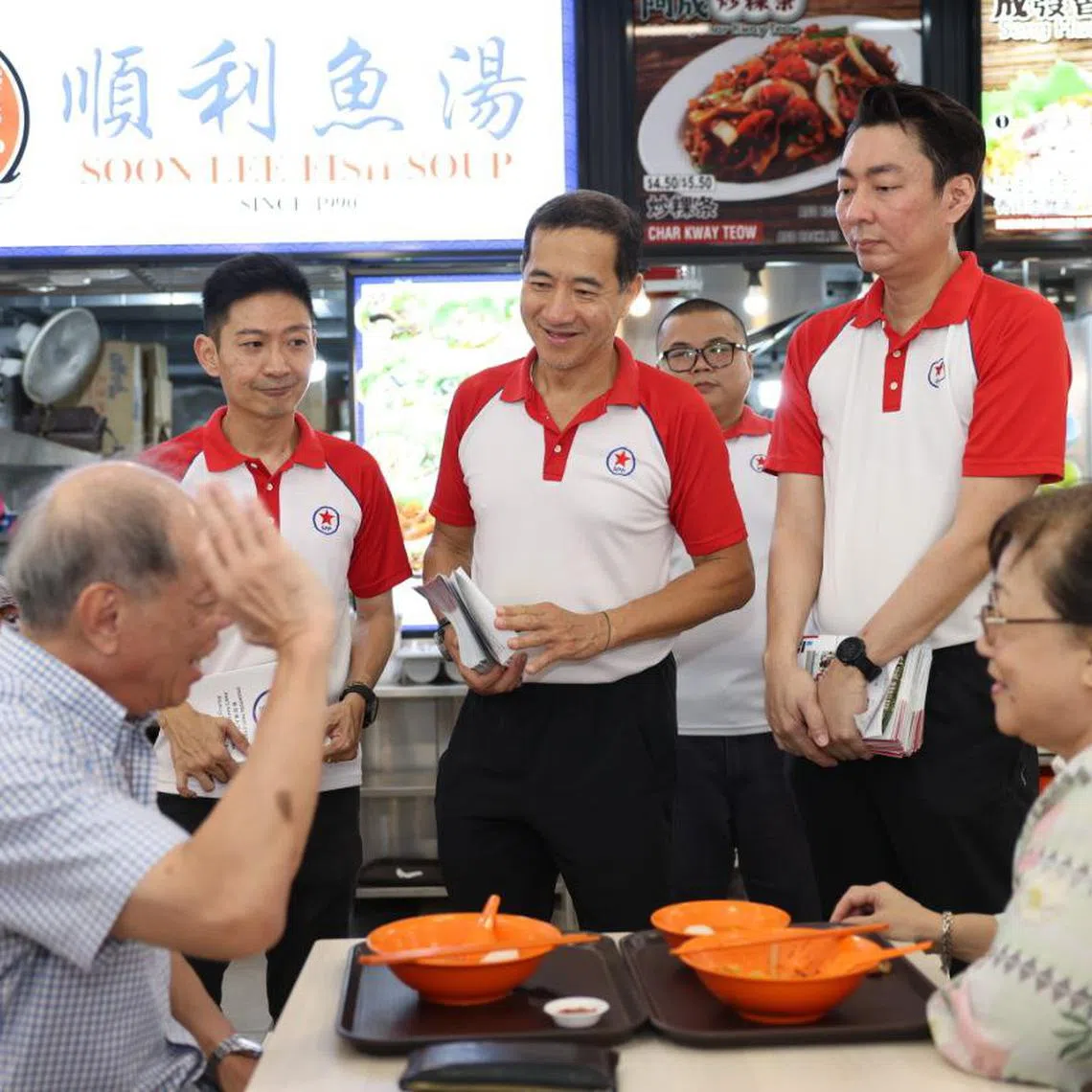 (From left) SPP treasurer Williiamson Lee, secretary-general Steve Chia and party chairman Melyvn Chiu during the a walkabout at Toa Payoh Palm Spring on March 29.