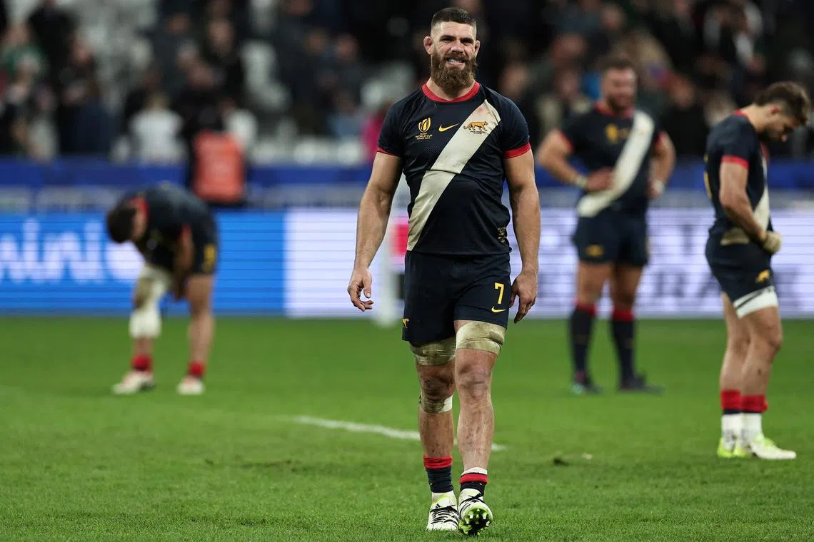 Argentina's openside flanker Marcos Kremer (centre) reacts after losing to England in the third place match at the Rugby World Cup in France on Friday.
