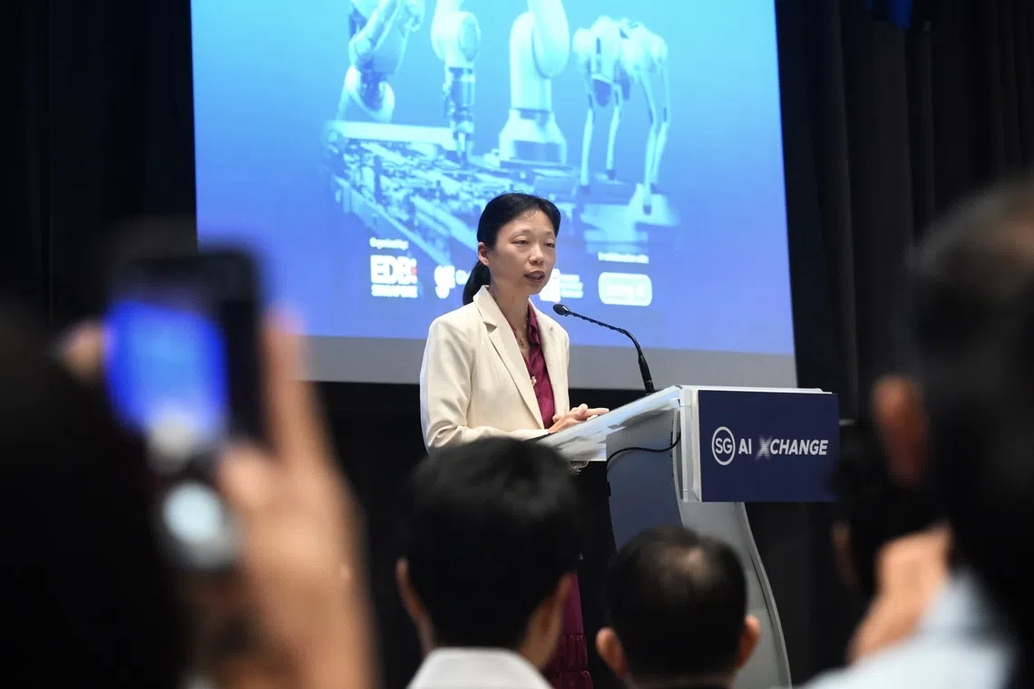 Acting Minister for Manpower Jasmin Lau speaking at the inaugural SG AI Xchange on Sept 17.