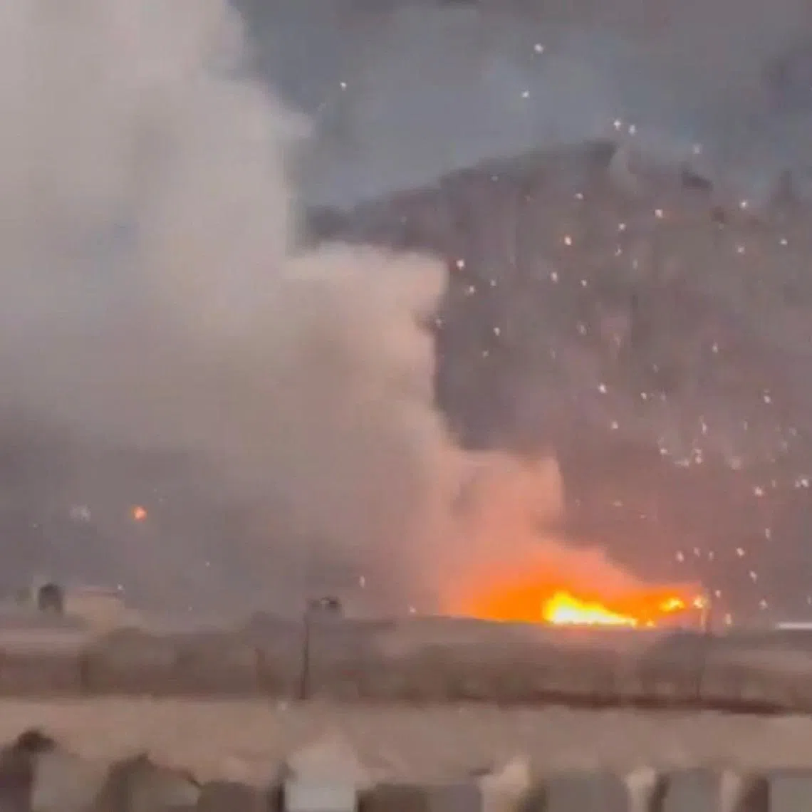 Smoke rises following a reported strike in Baharestan, Isfahan province in Iran, on April 1.