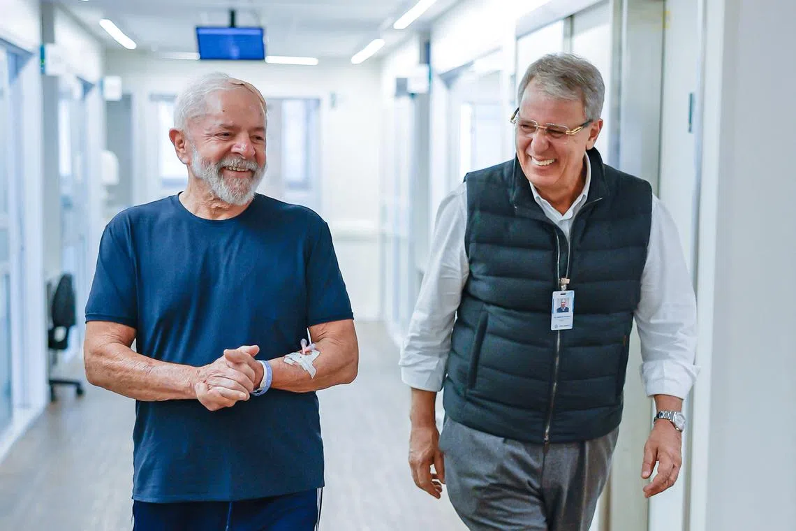 President Luiz Inacio Lula da Silva (left) walking with his neurosurgeon, Dr Marcos Stavale, on Dec 13.