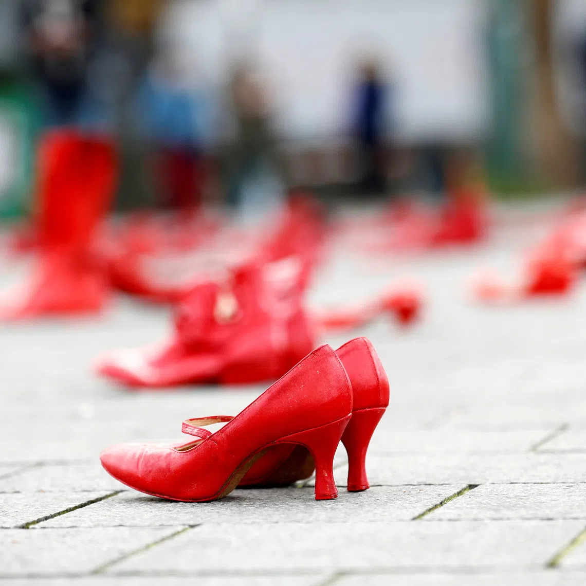 FILE PHOTO: Red shoes are placed on the ground during a demonstration against all kinds of violence towards women in central Brussels, Belgium November 24, 2019. REUTERS/Francois Lenoir/File Photo