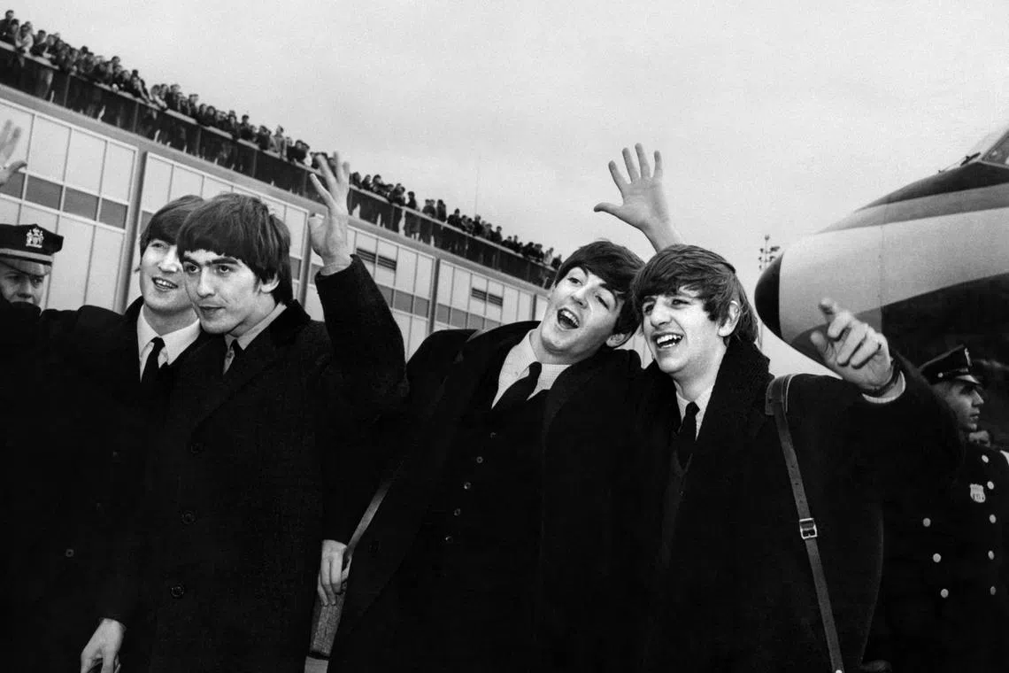 English band the Beatles with, from left to right, John Lennon, Ringo Starr, Paul McCartney and George Harrison, arrive at John F. Kennedy Airport in New York, United States, where they're greeted by a large crowd on Feb 07, 1964. The fab four are back, with each member of the iconic Beatles to be immortalised in their own big screen biopic, all directed by Sam Mendes, Sony Pictures said on Feb 20, 2024. 
