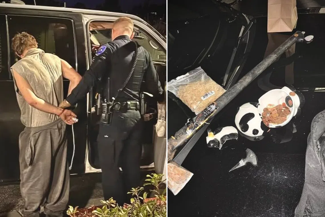 An officer restrains a man who broke into a church in Antioch, California, using an axe on Nov 28.