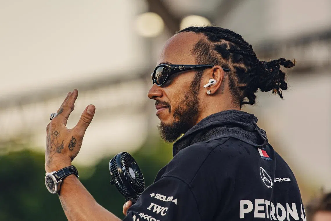 British driver Lewis Hamilton of Mercedes gesturing during the drivers' parade ahead of the Formula One Singapore Grand Prix at the Marina Bay Street Circuit on Sept 22.