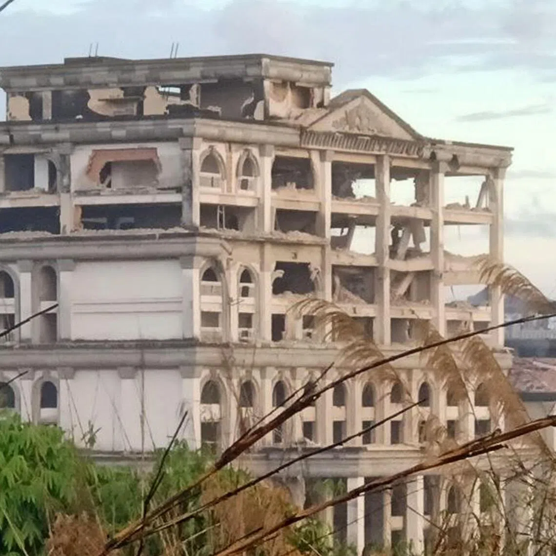 The photo, taken on Dec 13, 2025, shows damage to a casino caused by Thai strikes in Pursat Province, amid clashes along the Cambodia-Thailand border.