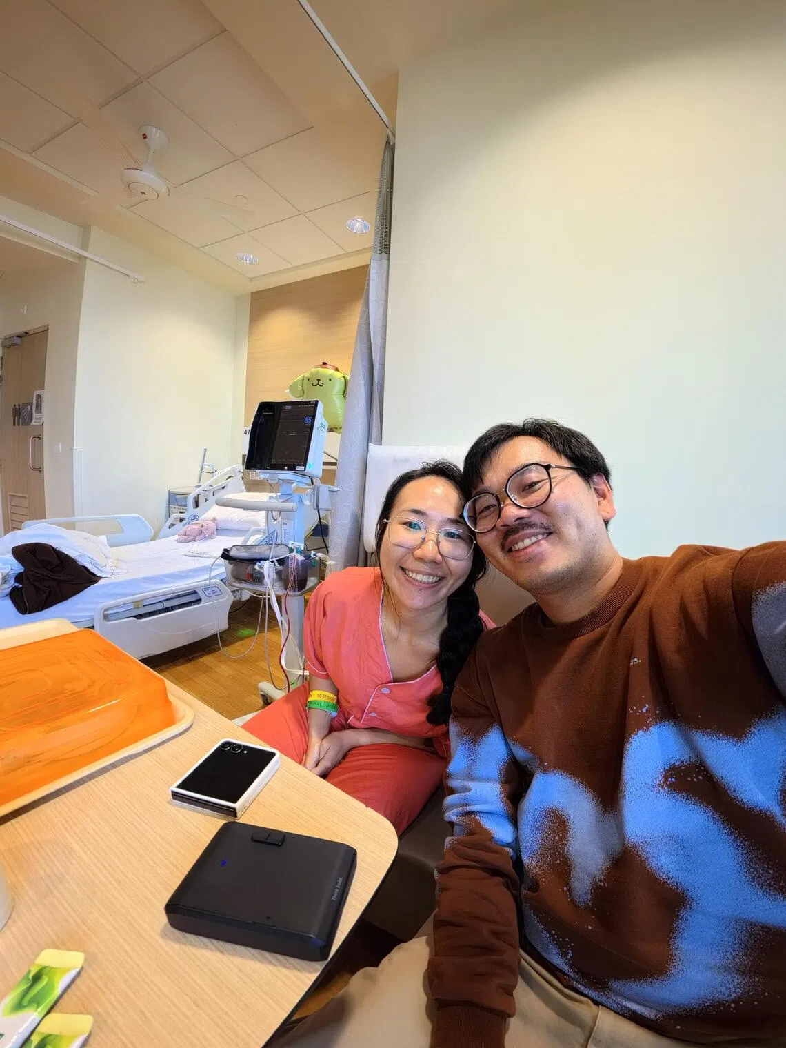 Breast cancer patient Shermin Shu and her fiance Jacky Ng in March during the time she had cancer surgery.