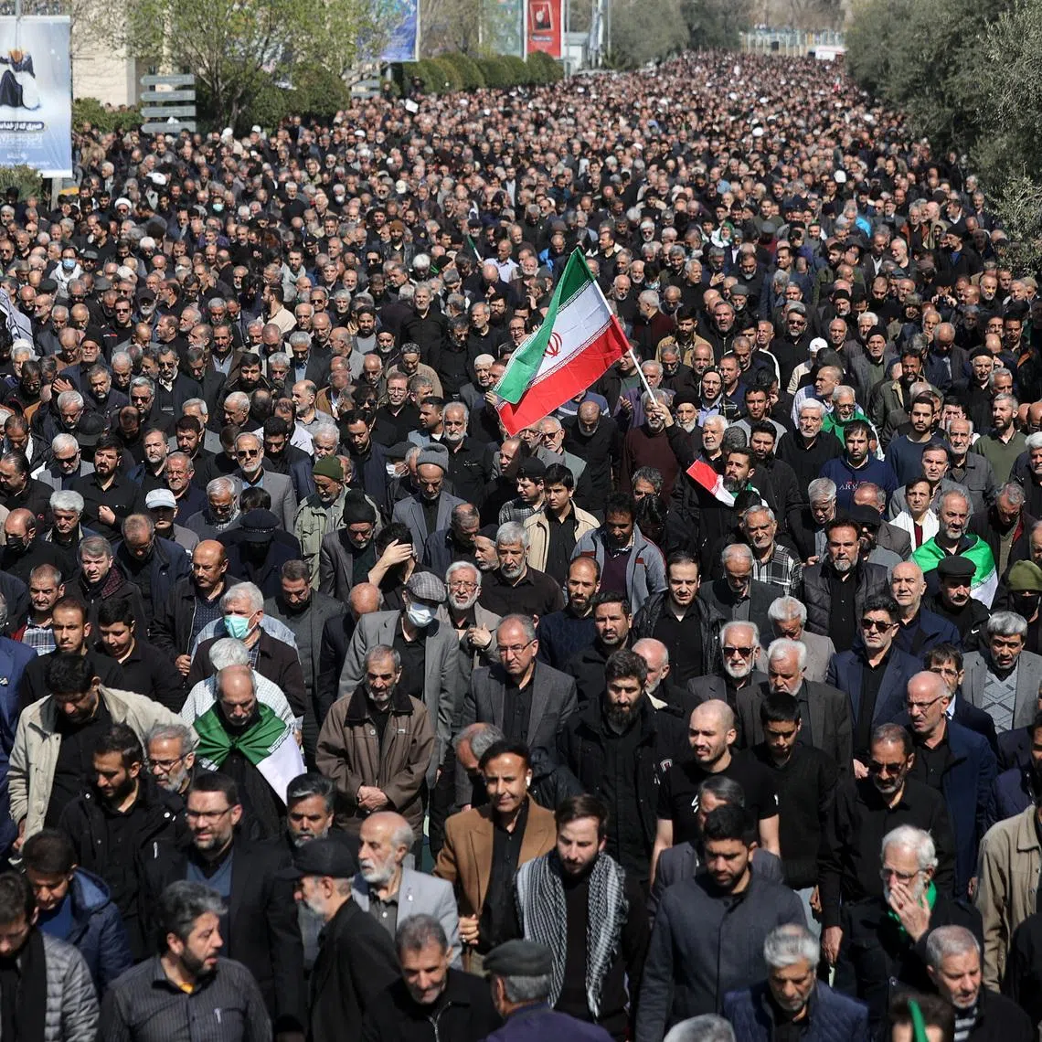 A man waves an Iranian flag, as Muslims attend Friday prayer, amid the U.S.-Israeli conflict with Iran, in Tehran, Iran, March 6, 2026. Majid Asgaripour/WANA (West Asia News Agency) via REUTERS