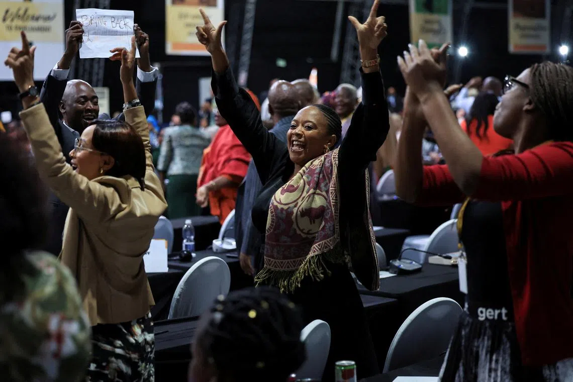 FILE PHOTO: African National Congress (ANC) members of parliament react after South African lawmakers passed the budget's fiscal framework in Cape Town, South Africa, April 2, 2025. REUTERS/Esa Alexander/File Photo
