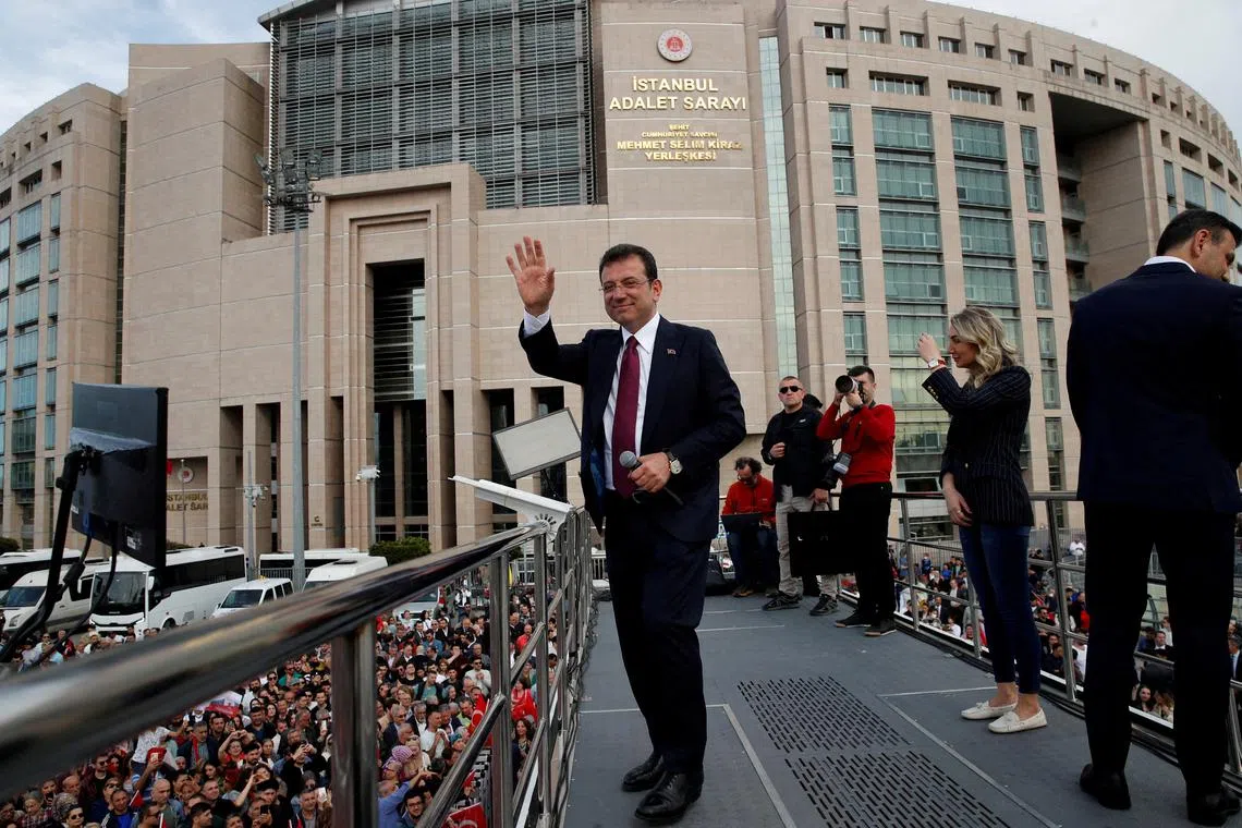 FILE PHOTO: Istanbul Mayor Ekrem Imamoglu, re-elected on Sunday, greets his supporters after receiving mayoral certificate in front of the Caglayan Courthouse in Istanbul, Turkey April 3, 2024. REUTERS/Dilara Senkaya/File Photo
