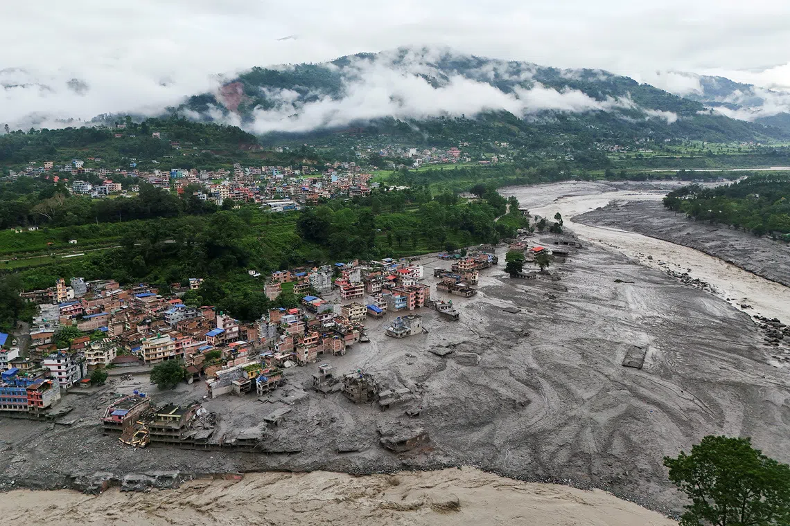 A drone view shows mud covering properties following a flash flood in Trishuli, Nuwakot district, Nepal, August 27, 2026. REUTERS/Navesh Chitrakar
