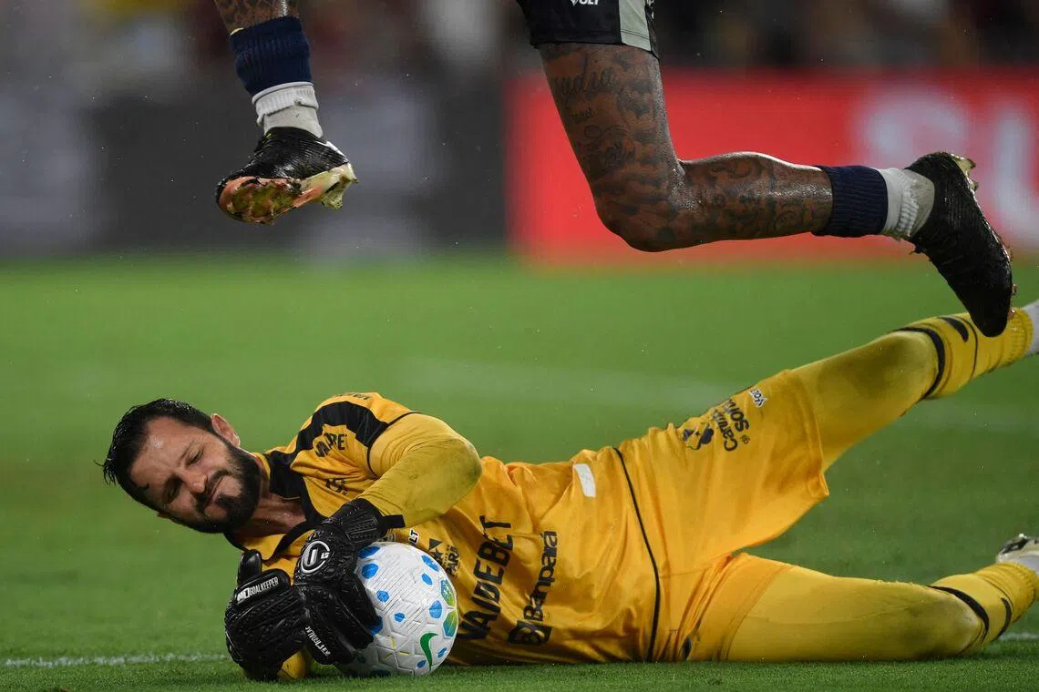 TOPSHOT - Remo's goalkeeper catching the ball during the Brasileirao Serie A football match between Flamengo and Remo, at the Maracana Stadium in Rio de Janeiro, Brazil, on March 19, 2026. 