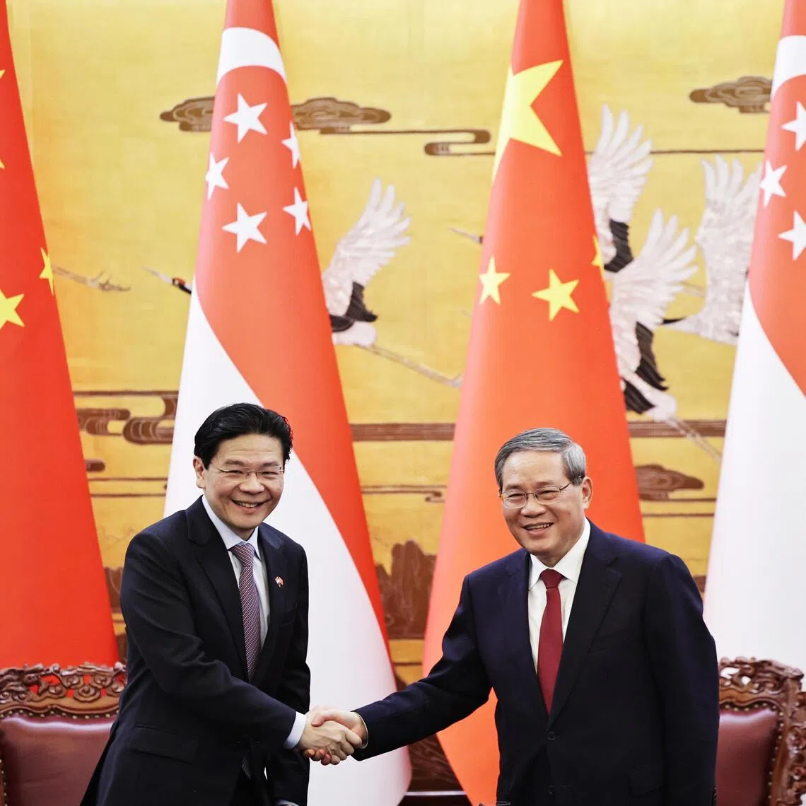 Singapore Prime Minister Lawrence Wong (left) and Chinese Premier Li Qiang (right) in Beijing on June 23.