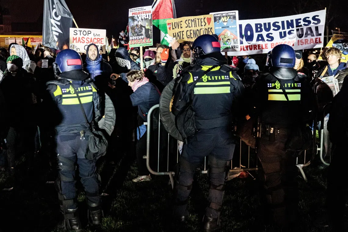 Police and protesters face off outside the Royal Concertgebouw concert hall in Amsterdam on Dec 14.