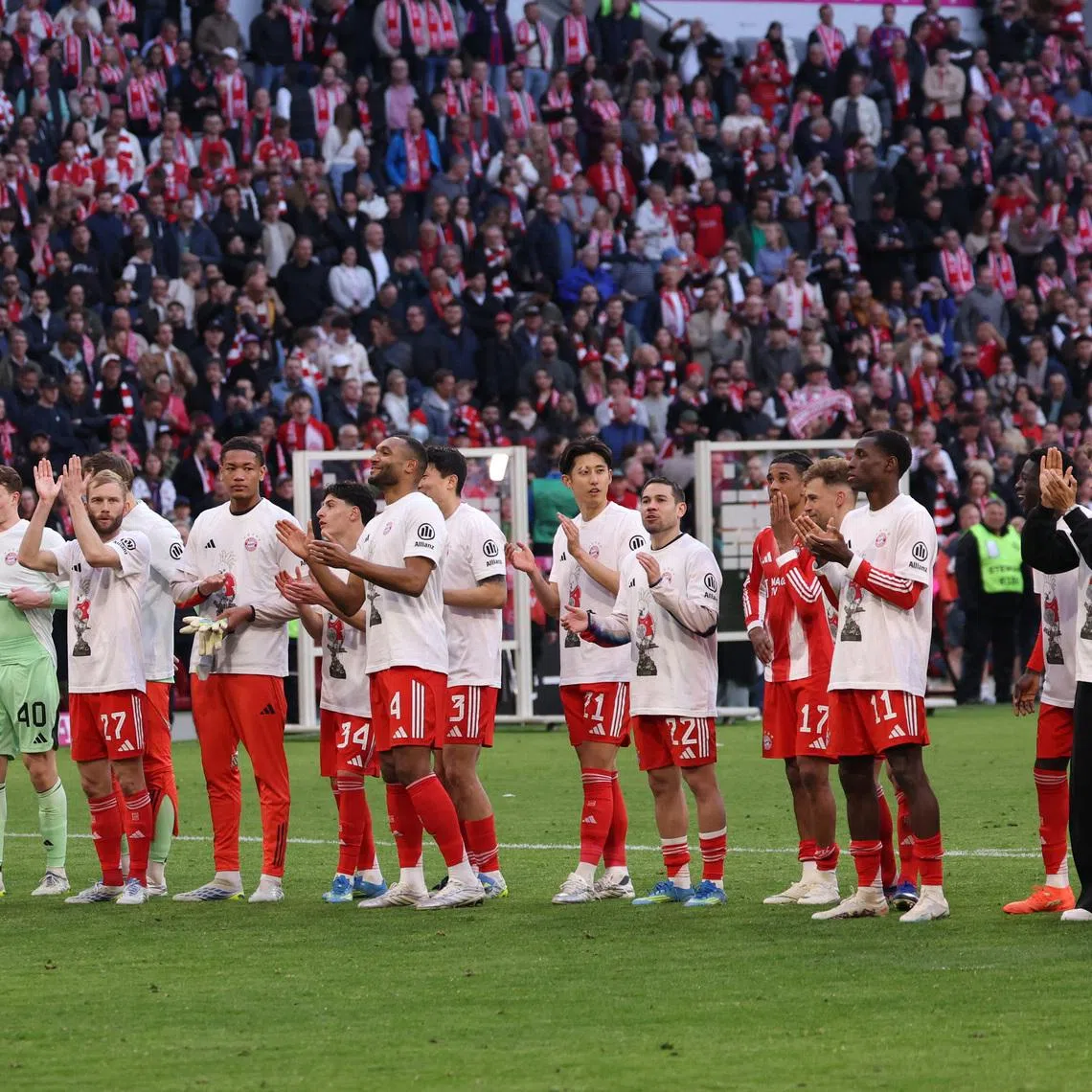 Soccer Football - Bundesliga - Bayern Munich v VfB Stuttgart - Allianz Arena, Munich, Germany - April 19, 2026 Bayern Munich players celebrate after winning the Bundesliga REUTERS/Gintare Karpaviciute