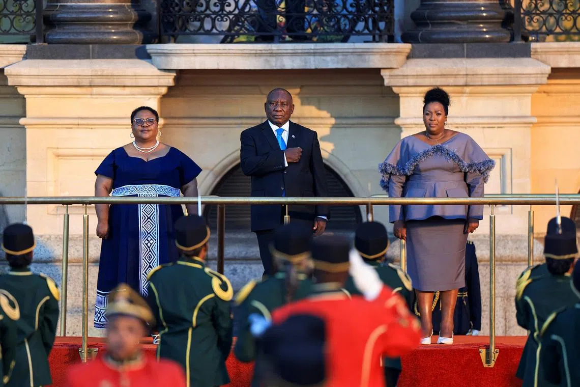 South African President Cyril Ramaphosa holds his hand on his chest during a national anthem at the Cape Town City Hall ahead of his State of the Nation Address (SoNA) in Cape Town, South Africa, February 12, 2026. REUTERS/Esa Alexander