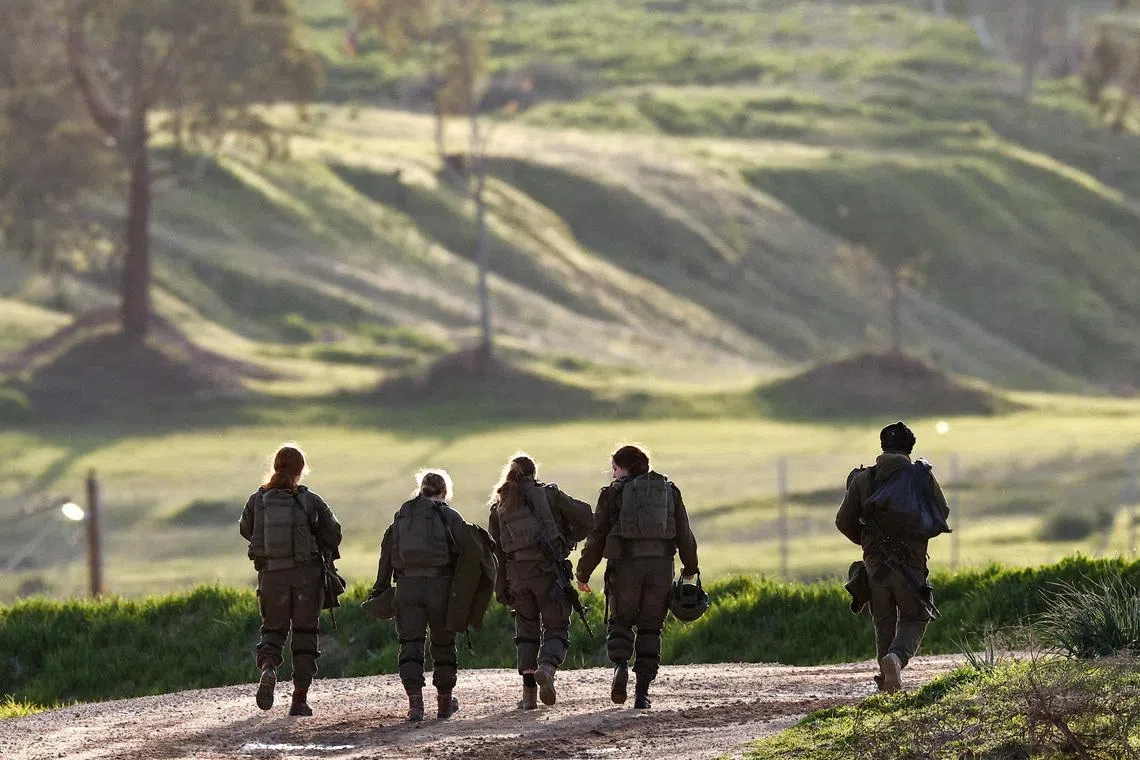 Israeli soldiers patrol near the border with Gaza, in Israel, on Jan 20.