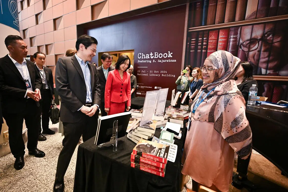Prime Minister Lawrence Wong and former MP and journalist Irene Ng at the ChatBook showcase at National Library Building on July 22.