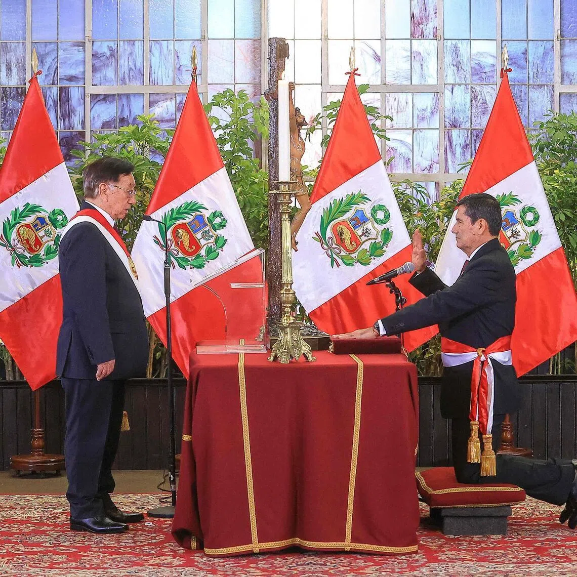 Peru's interim President Jose Maria Balcazar (left) and the new prime minister, Mr Luis Enrique Arroyo (right), during the swearing-in ceremony at the Government Palace in Lima on March 17, 2026. 
