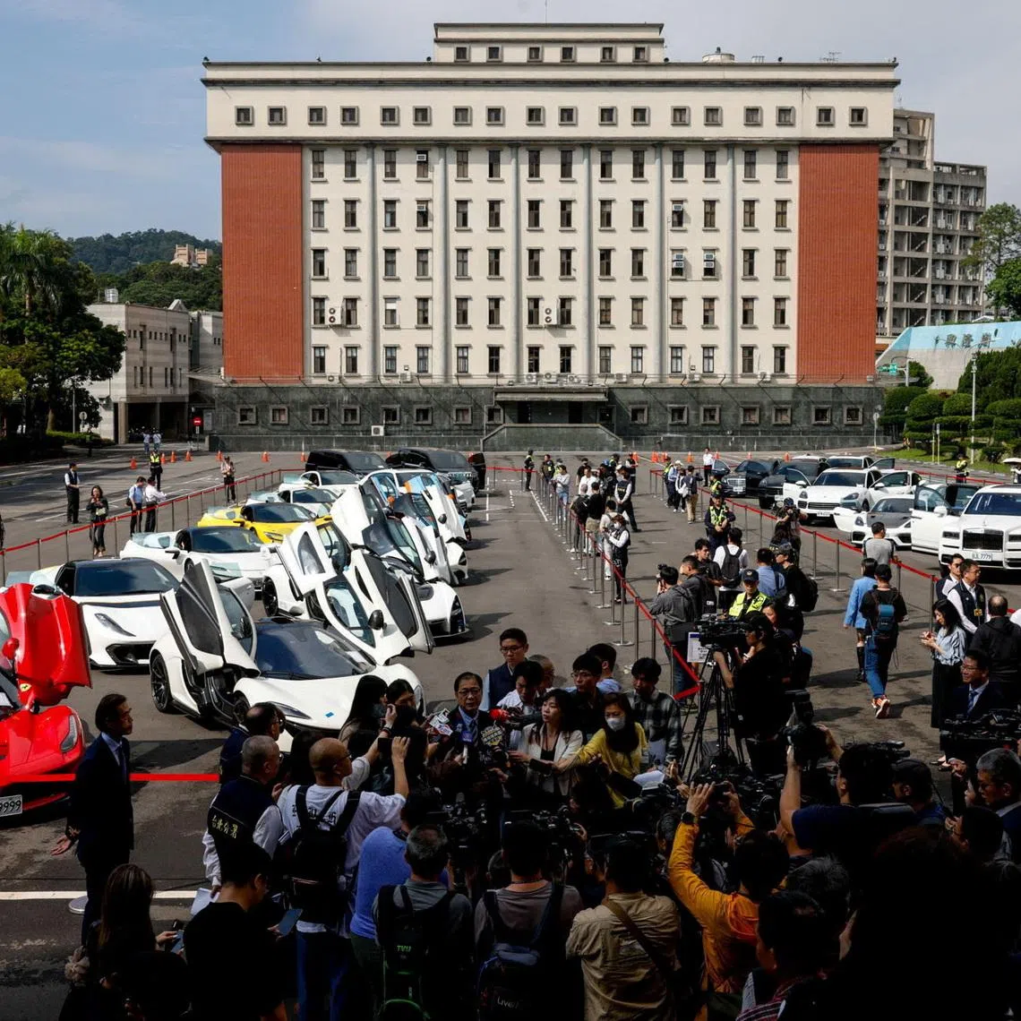 Luxury cars to be auctioned off are on display in Taiwan.