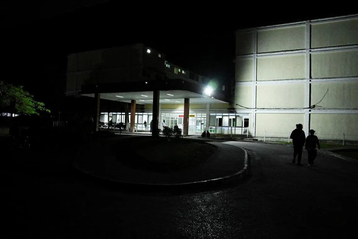 People approach the entrance of the Provincial Clinical–Surgical Hospital \"Arnaldo Milian Castro,\" where, according to local information, injured people were being treated after an armed incident involving a Florida-registered speedboat and a Cuban patrol, at a time of heightened tensions with the United States, in Santa Clara, Cuba, February 25, 2026. REUTERS/Norlys Perez