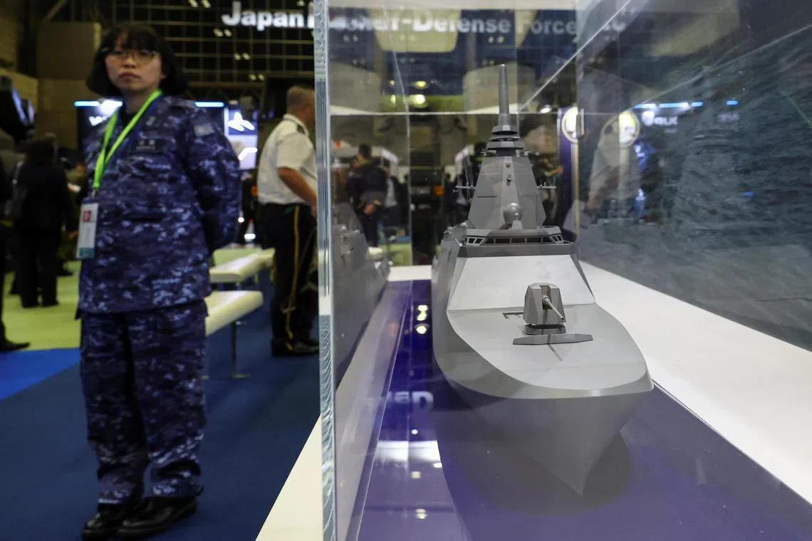 Mogami-class warships are advanced stealth frigates equipped with a potent array of weapons.

A person standing next to a mock model of the FFM "Upgraded Mogami" class displayed during the Defence Security Equipment International (DSEI) Japan at Makuhari Messe in Chiba, east of Tokyo, on May 21. 
