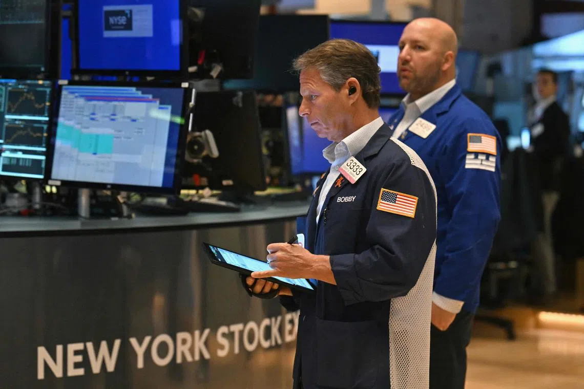 Traders works on the floor of the New York Stock Exchange, in New York City.