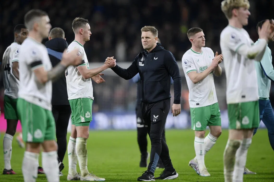 Newcastle United's Sean Longstaff and manager Eddie Howe look dejected after the match.
