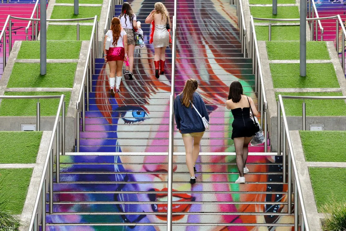 FILE PHOTO: People walk on the 'Swiftie Steps' ahead of a Taylor Swift concert, following the cancellation of three Taylor Swift concerts in Vienna because of a planned attack, at Wembley Stadium in London, Britain, August 15, 2024.  REUTERS/Toby Melville/File Photo