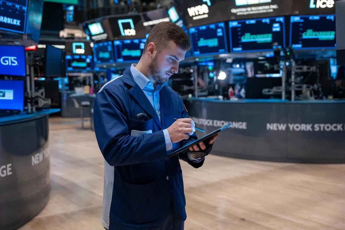 Traders work on the floor of the New York Stock Exchange, on July 22, 2024 in New York City.