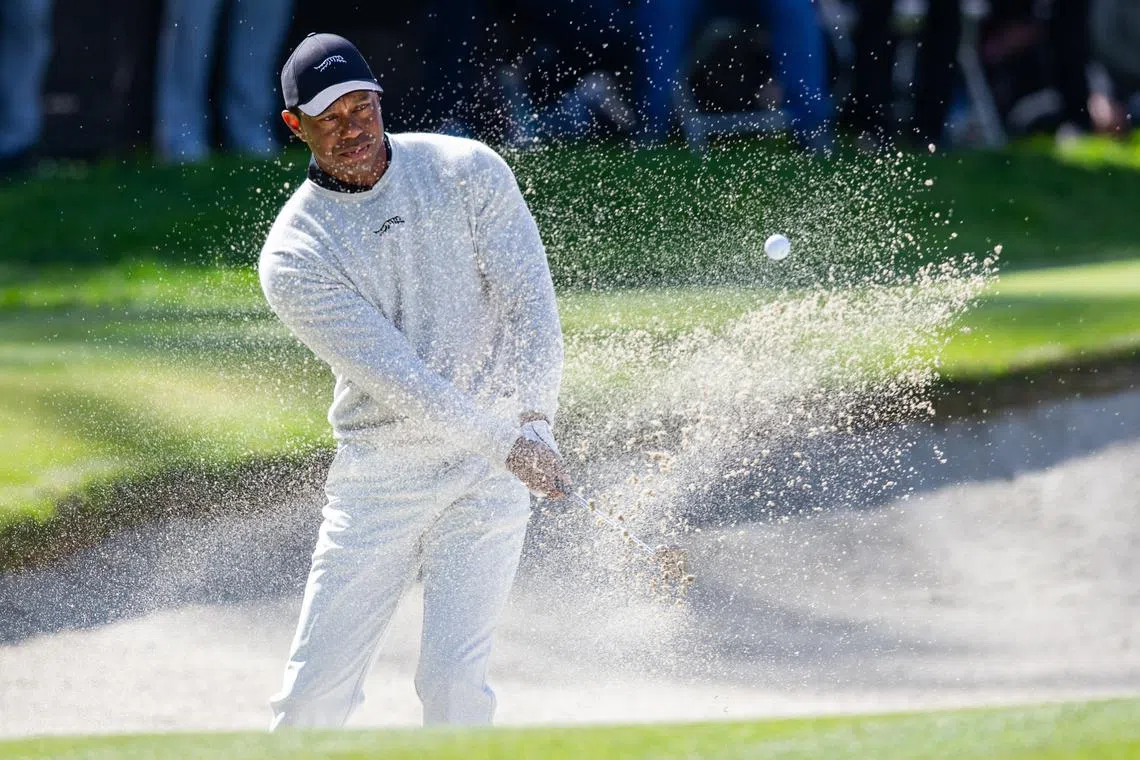 Feb 15, 2024; Pacific Palisades, California, USA; Tiger Woods hits from the sand on the tenth hole during the first round of The Genesis Invitational golf tournament. Mandatory Credit: Jason Parkhurst-USA TODAY Sports/File Photo