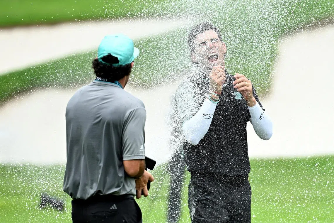 A delighted Joaquin Niemann of Chile enjoys a champagne shower after winning the LIV Golf event in Singapore.