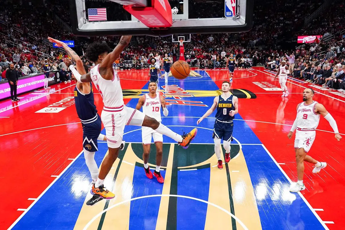Jalen Green of the Houston Rockets dunks the ball during the fourth quarter against the Denver Nuggets at Toyota Centre.