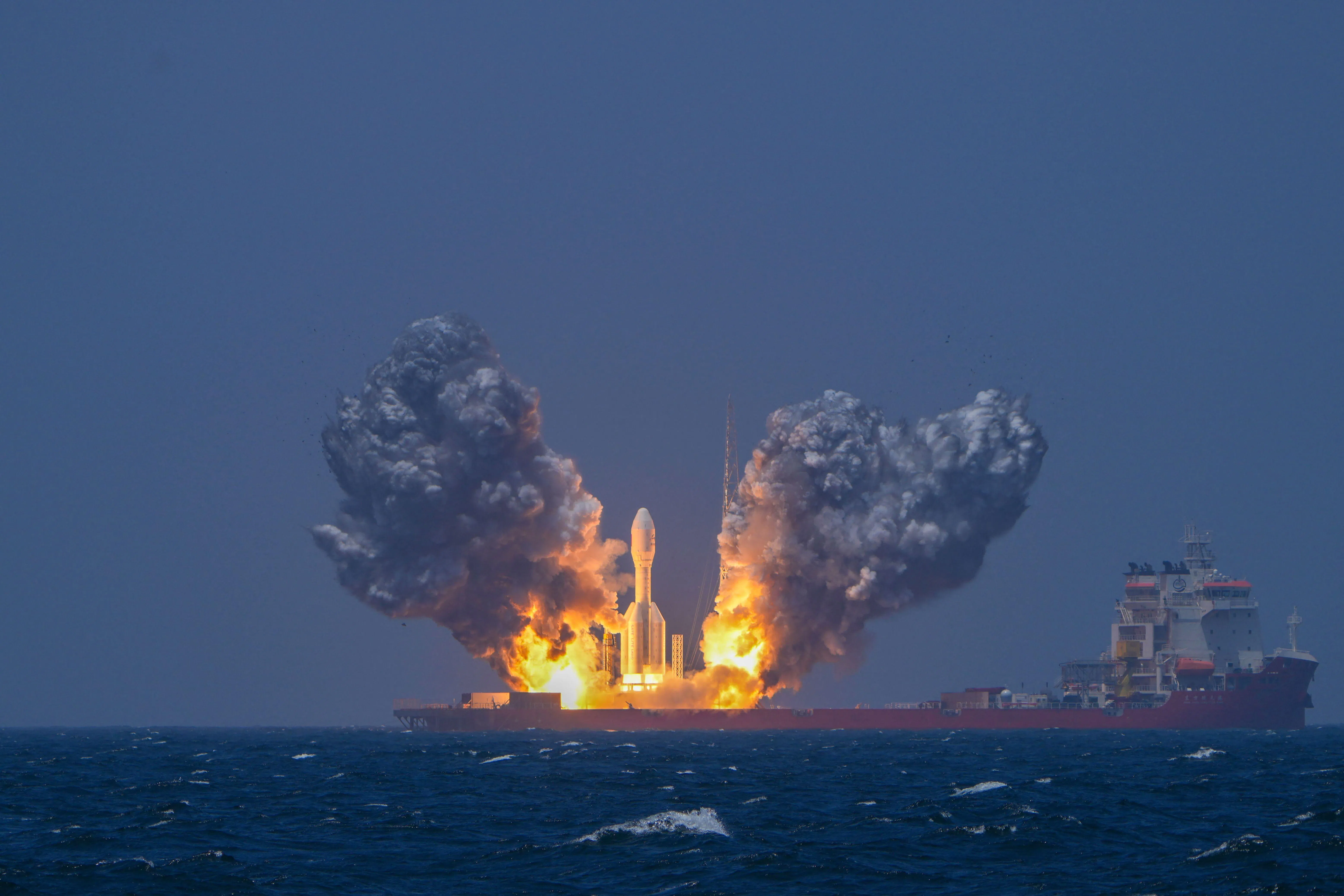 TOPSHOT - The Gravity-1 commercial rocket launches from the Taiyuan Satellite Launch Center carrying nine satellites to their designated orbits, at sea off the coast of Shanghai in eastern China on July 22, 2026. (Photo by CNS / AFP) / China OUT