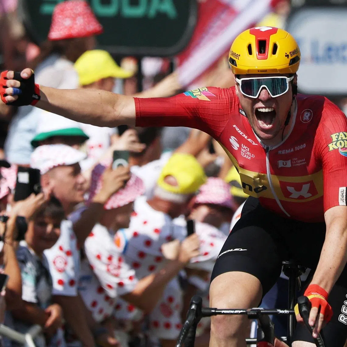 Uno-X Mobility’s Soren Waerenskjold celebrates winning stage 11 of the Tour de France on July 15.