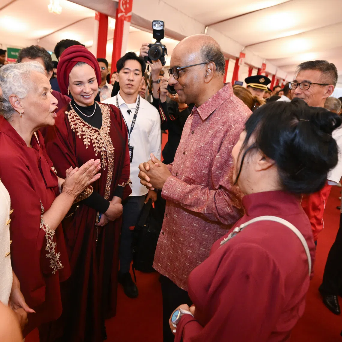 President Tharman Shanmugaratnam (second from right) and his spouse Jane Ittogi Shanmugaratnam (far right) with (from left) Iman Fandi, Charmine Jacobs and Wendy Jacobs during the National Day Reception at the Istana on Aug 10.