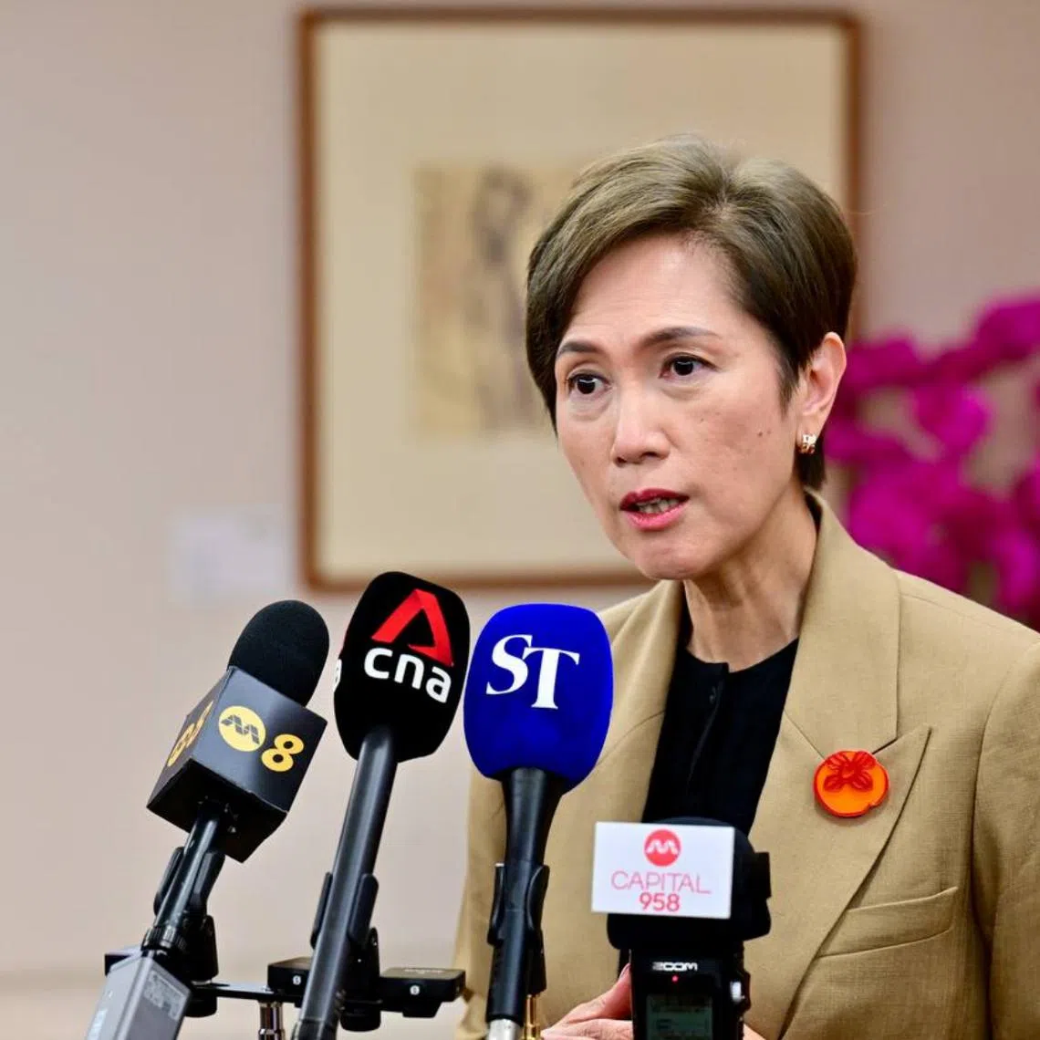 Minister for Communications and Information Minister Josephine Teo giving a door stop interview to the media after the briefing on Feb 21.