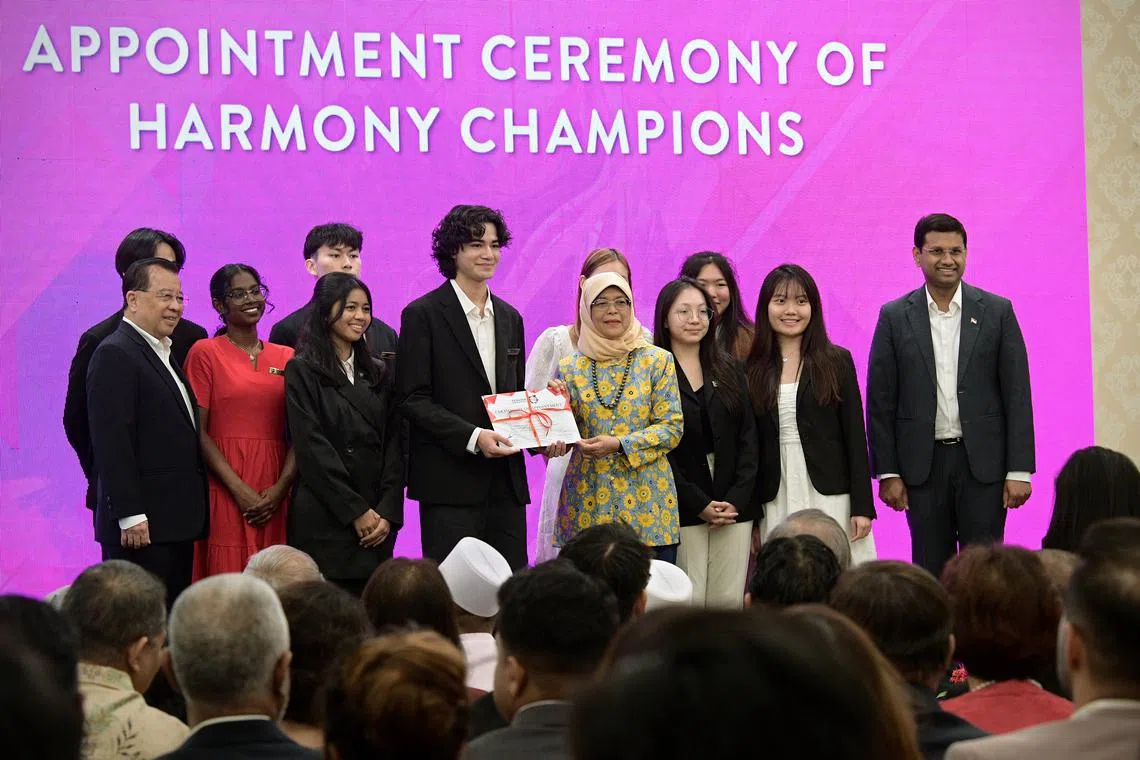 Students from Republic Polytechnic being appointed Harmony Champions by President Halimah Yacob at the Roses of Peace celebration on Feb 26, 2023.