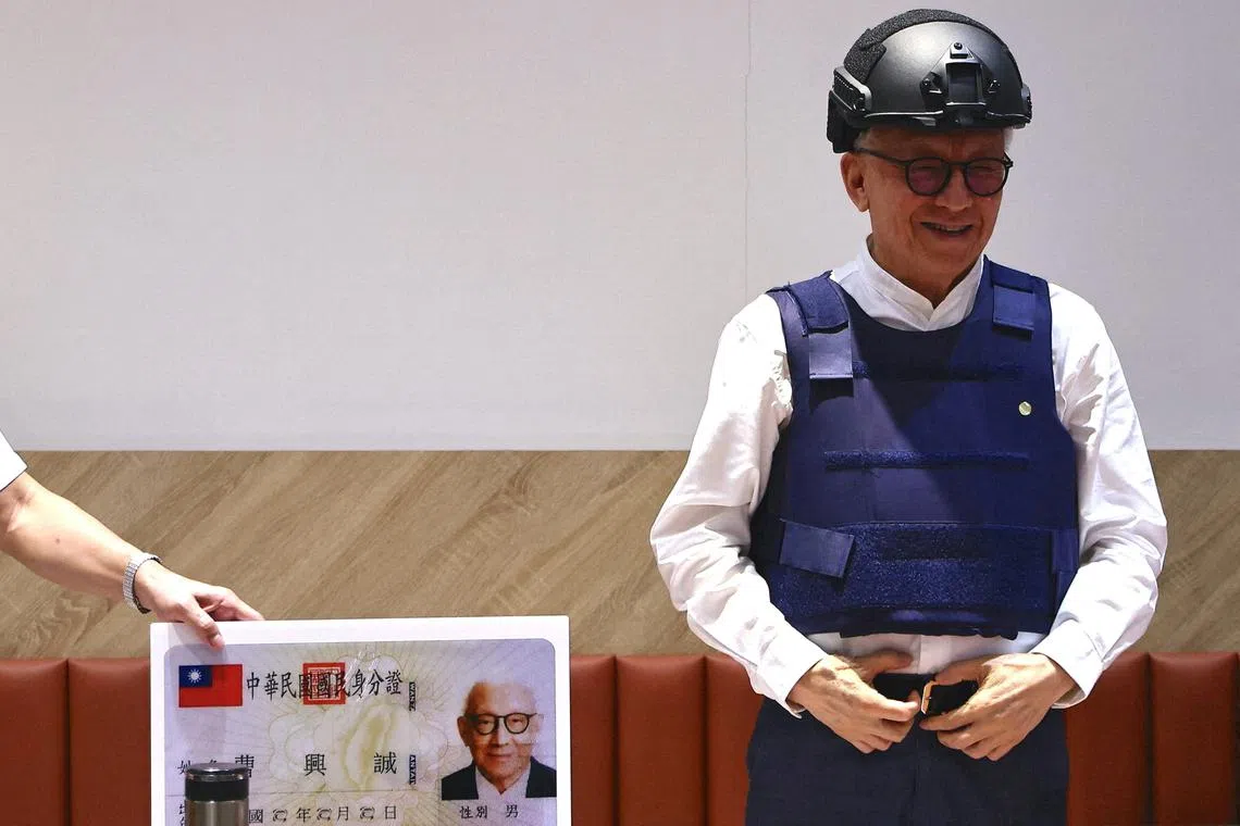 FILE PHOTO: Robert Tsao, the former chairman of contract microchip maker UMC, poses for photos at a news conference where he announces his plans to fund civil defense education in Taipei, Taiwan, September 1, 2022. REUTERS/Ann Wang/File Photo